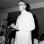 I am speaking at a public meeting. Like other priests at the time, I  wore the white Indian shirt known as a 'khurta'.