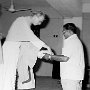 Flanked by Fr Raymond Ambrose, I receive the offertory gifts. The persons offering the gifts are first Thumma George, then Thomas Kunnil.