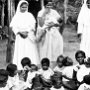 Sisters visiting a small village. They are involved in a session of teaching basic hygiene and health to mothers with young children.