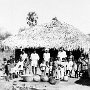 Typical scene in the low caste quarter of a village. Two family houses are shown.