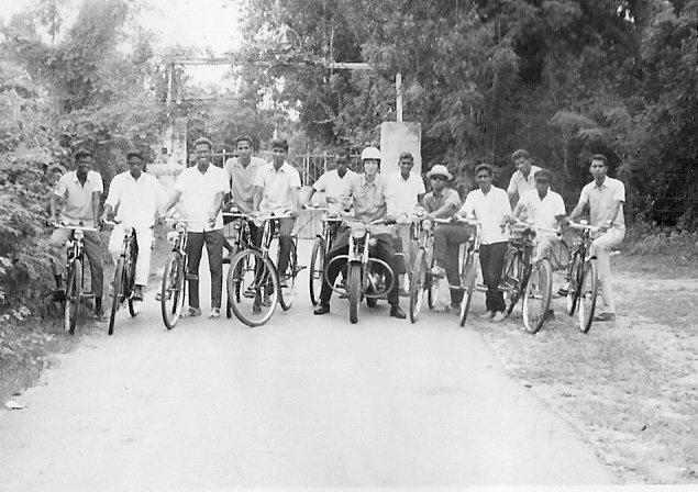 I am on my motorbike surrounded by students. 1971.