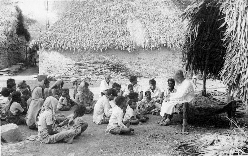 Fr Boon of Kurnool diocese instructing villagers outside their prayer hut.