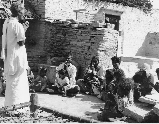 Catechist instructing a small group of catechumens.