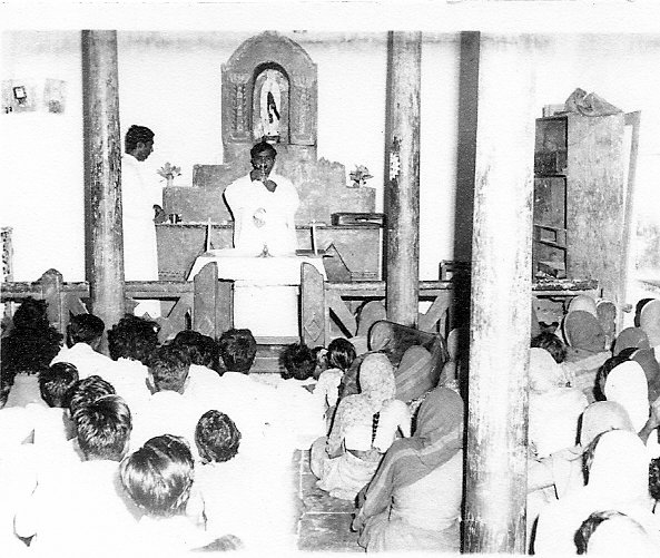 Mass in a mud-brick prayer hut.