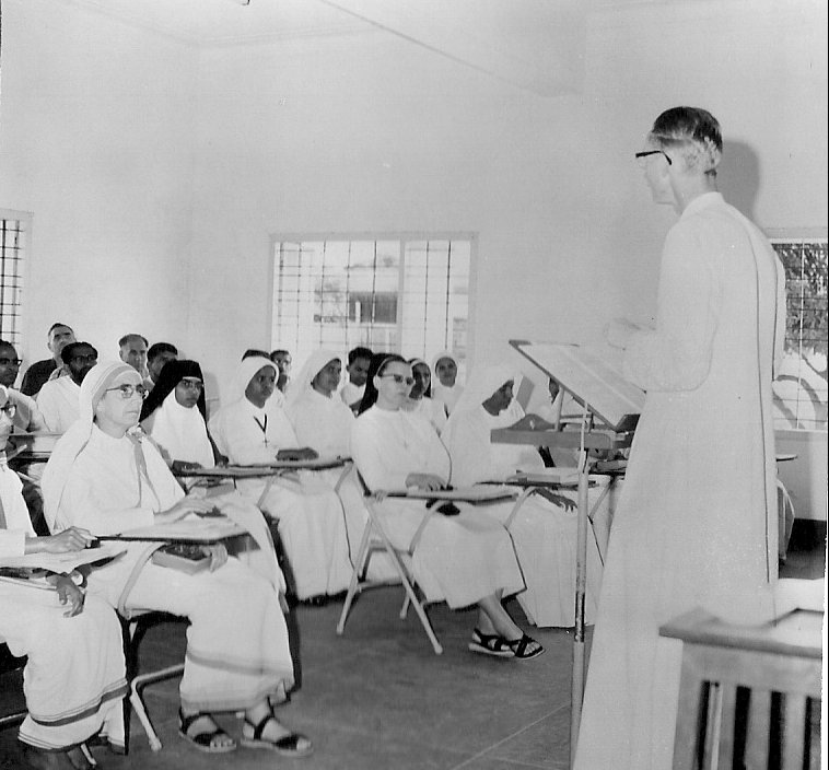 Me teaching a class to a group of sisters, with some men in the audience too